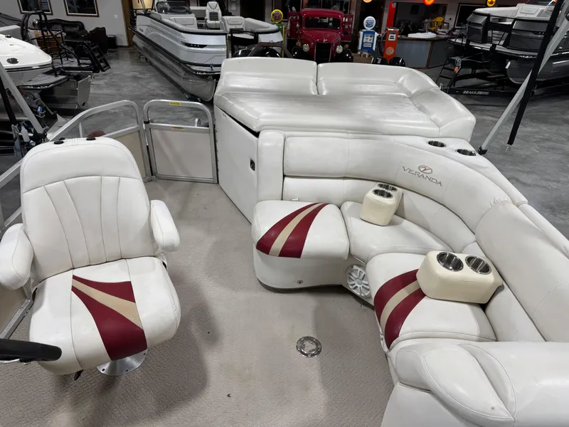 Slide: The Image of 2007 Veranda VP 22 pontoon boat interior with white and red seating. - 9
