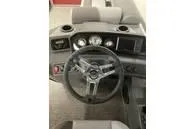 Slide: The Image of 2024 Bennington SV Line boat dashboard with steering wheel and gauges. - 10