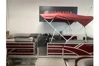Slide: The Image of 2024 Bennington SV Line pontoon boat with red canopy in showroom. - 8