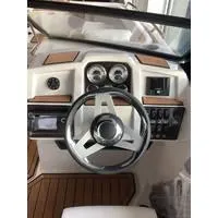 Slide: The Image of 2023 Starcraft SVX 210 OB DC boat dashboard with steering wheel and gauges. - 3