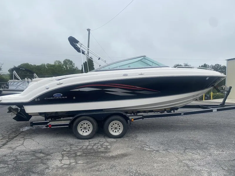 Slide: The Image of 2005 Chaparral 236 SSi boat on trailer, sleek design, black and white exterior. - 1