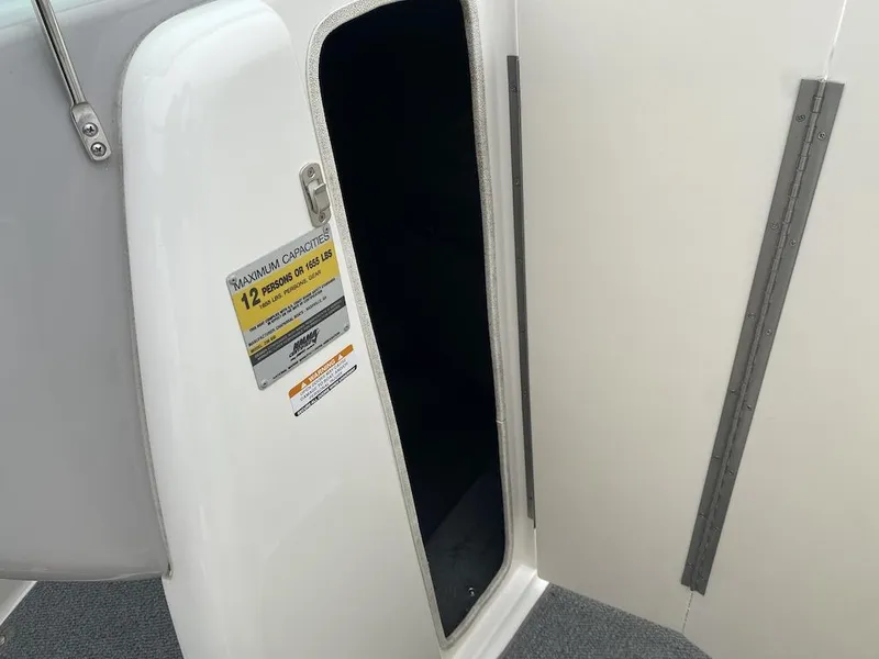 Slide: The Image of 2005 Chaparral 236 SSi boat interior with capacity label for 12 persons or 1655 lbs. - 10