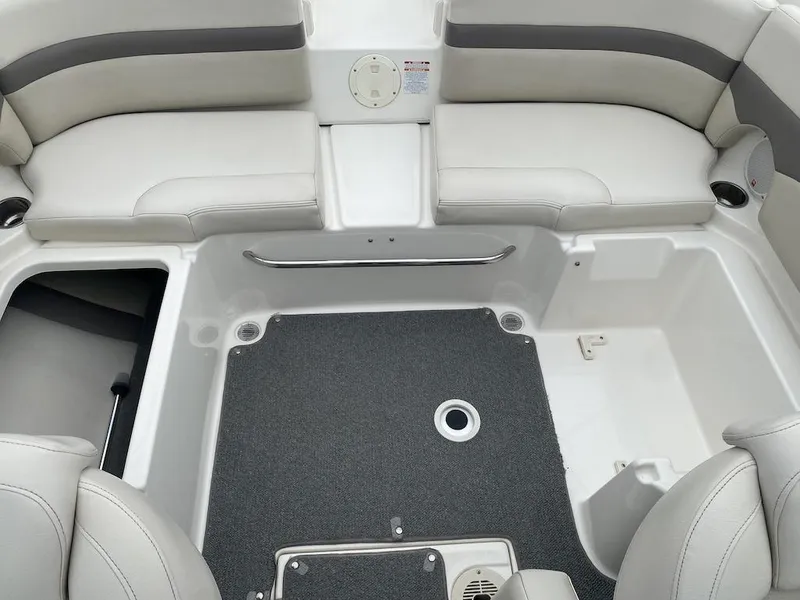 Slide: The Image of 2005 Chaparral 236 SSi boat interior with gray seating and carpeted floor. - 16