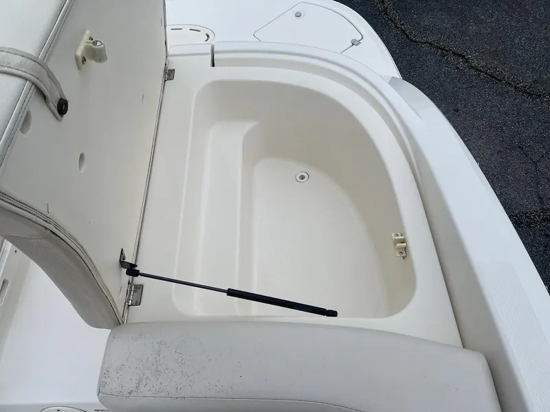 Slide: The Image of Open storage compartment on a 2005 Chaparral 236 SSi boat. - 19