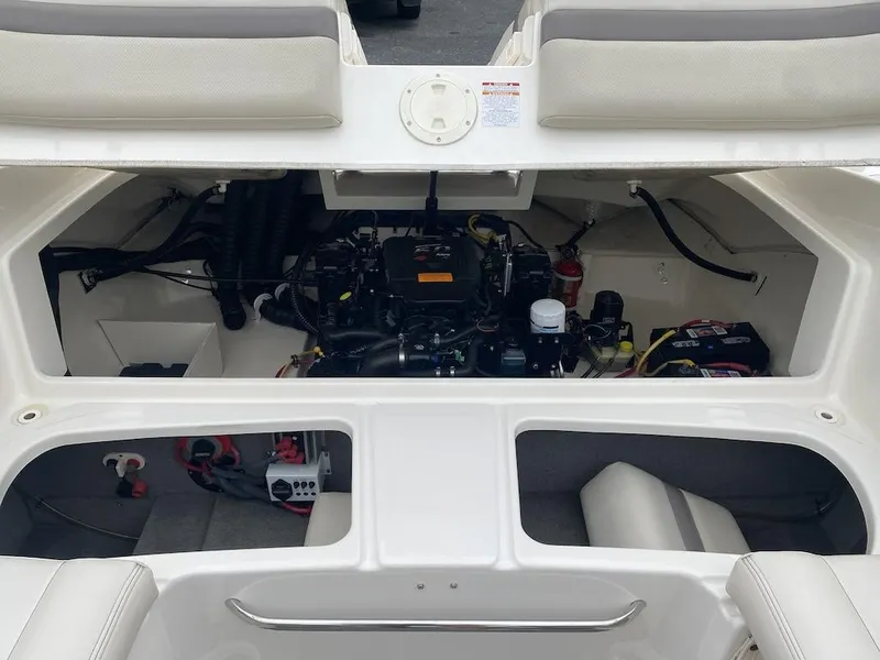 Slide: The Image of Engine compartment of a 2005 Chaparral 236 SSi boat, showcasing internal components. - 21