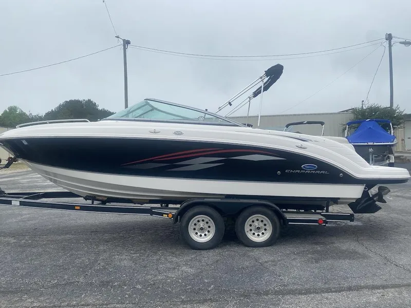 Slide: The Image of 2005 Chaparral 236 SSi boat on trailer, black and white design, parked outdoors. - 3