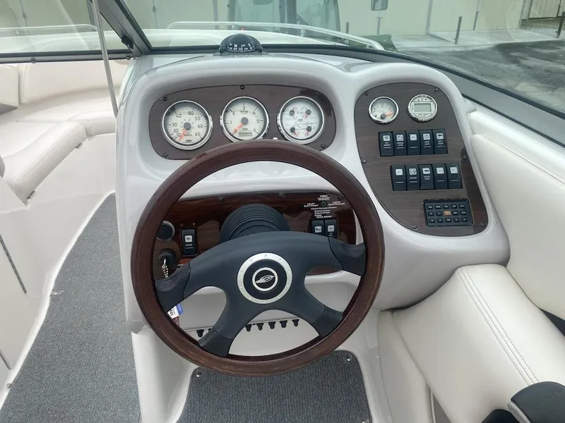 Slide: The Image of 2005 Chaparral 236 SSi boat dashboard with steering wheel and instrument panel. - 5