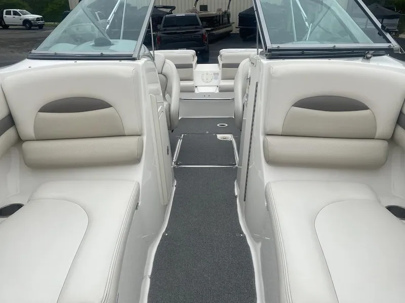 Slide: The Image of 2005 Chaparral 236 SSi boat interior with white seating and windshield. - 8