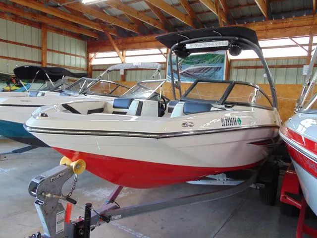 Slide: The Image of 2020 Yamaha Boats AR195 in storage, featuring a sleek red and white design. - 3