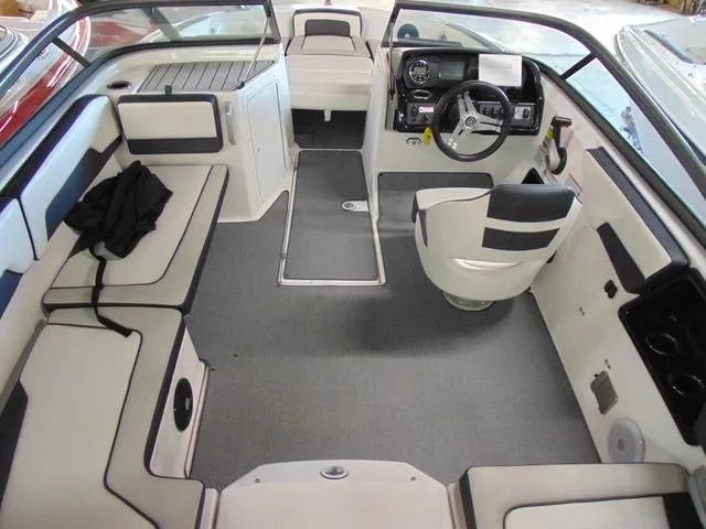 Slide: The Image of 2020 Yamaha Boats AR195 interior with seating, steering wheel, and dashboard. - 6