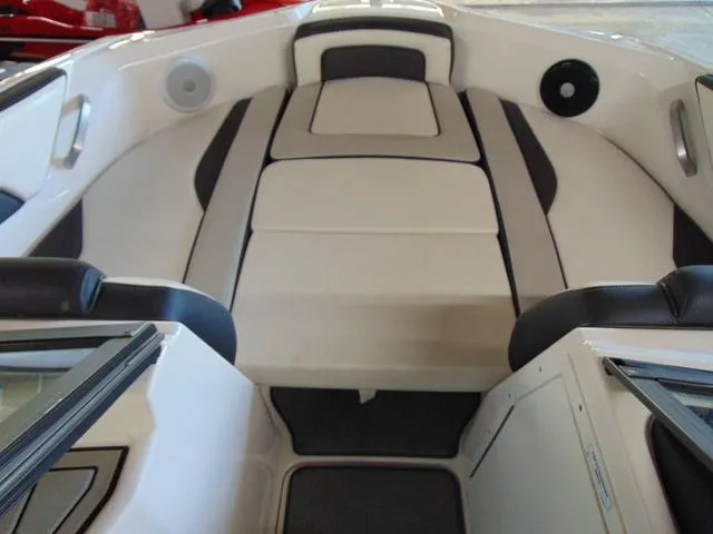 Slide: The Image of 2020 Yamaha Boats AR195 interior with cushioned seating and sleek design. - 8