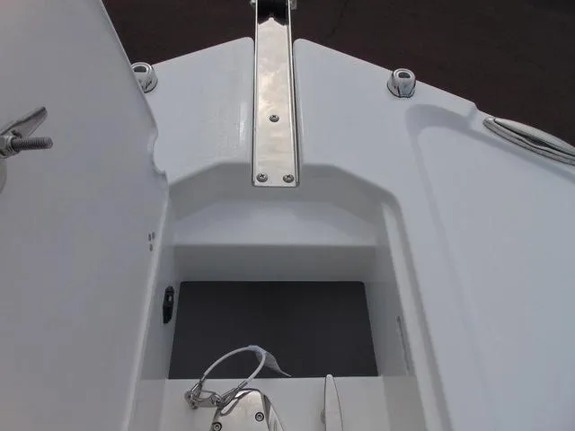Slide: The Image of 2025 Parker 2400 Center Console boat anchor storage compartment with open hatch. - 21