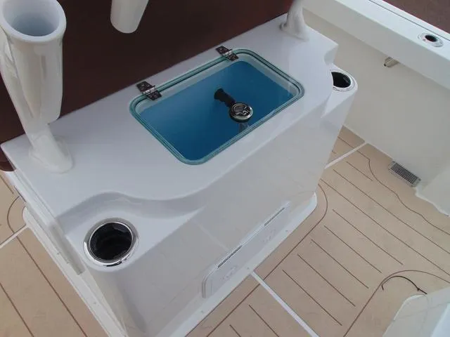 Slide: The Image of 2025 Parker 2400 Center Console boat with livewell and rod holders. - 26