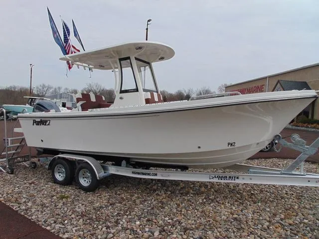 Slide: The Image of 2025 Parker 2400 Center Console boat on trailer, displayed outdoors. - 3