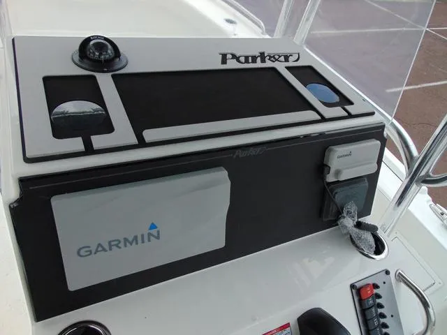 Slide: The Image of 2025 Parker 21SE Center Console dashboard with Garmin navigation system. - 12