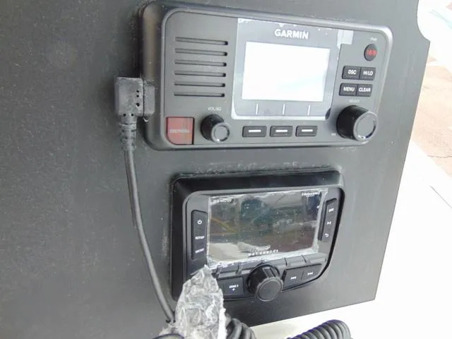 Slide: The Image of Control panel of a 2025 Parker 21SE Center Console boat with Garmin electronics. - 13