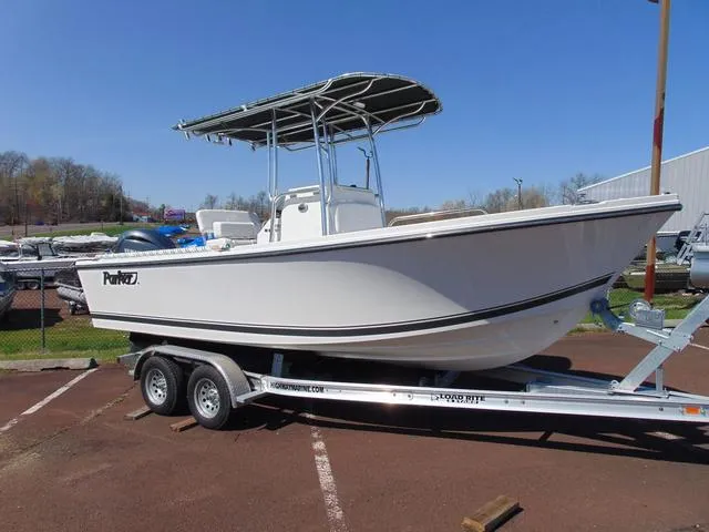 Slide: The Image of 2025 Parker 21SE Center Console boat on trailer, displayed outdoors. - 4