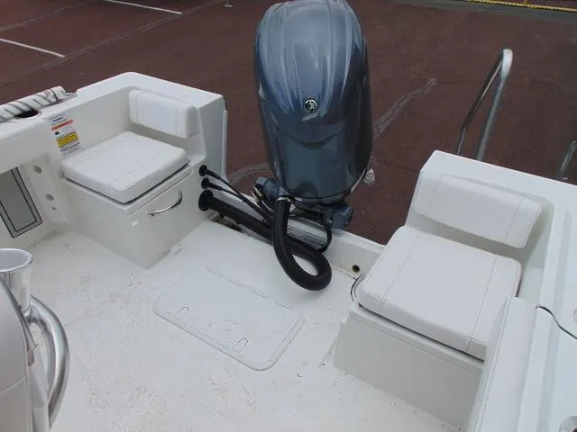 Slide: The Image of 2025 Parker 21SE Center Console boat interior with seating and outboard motor. - 8