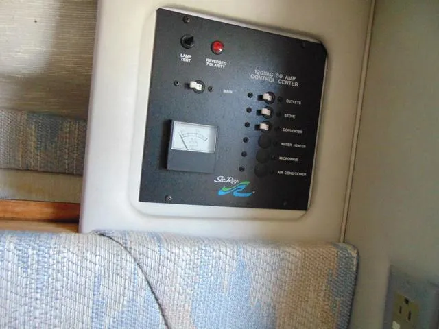 Slide: The Image of Control panel of a 1990 Sea Ray 260 Overnighter boat interior. - 19