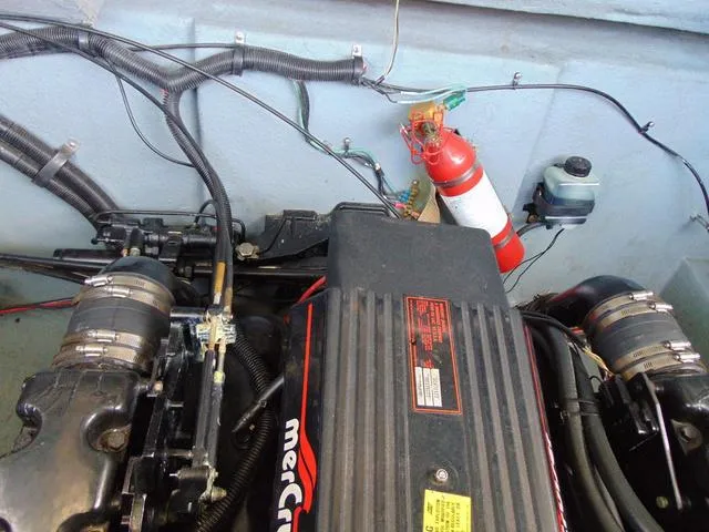 Slide: The Image of Engine compartment of 1990 Sea Ray 260 Overnighter with visible fire extinguisher and wiring. - 20