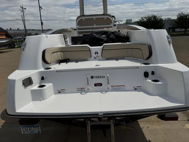 Slide: The Image of 2022 Yamaha Boats 255 FSH® SPORT E, rear view, showcasing seating and deck features. - 5