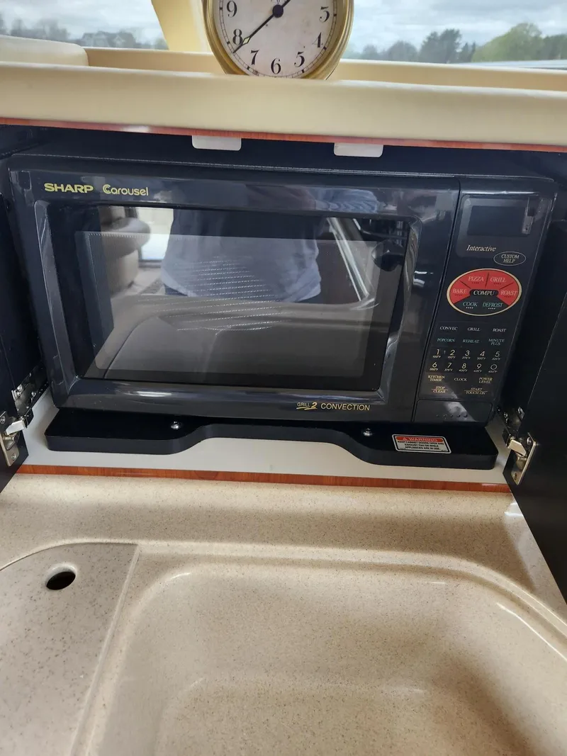 Slide: The Image of Microwave in 2004 Sea Ray 480 Sedan Bridge yacht kitchen. - 22