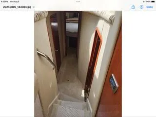 Slide: The Image of Stairway inside 2004 Sea Ray 480 Sedan Bridge yacht, leading to cabin area. - 32