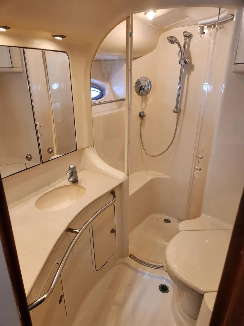 Slide: The Image of Luxurious bathroom in 2004 Sea Ray 480 Sedan Bridge yacht with shower and vanity. - 36