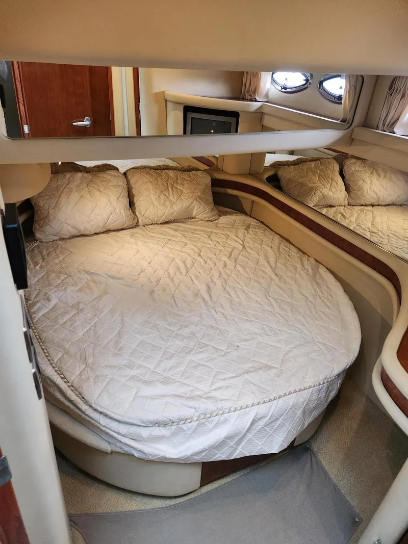 Slide: The Image of Luxurious 2004 Sea Ray 480 Sedan Bridge cabin with cozy bed and elegant interior. - 44
