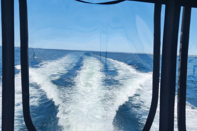 Slide: The Image of Wake view from a 2004 Sea Ray 480 Sedan Bridge on open water. - 6
