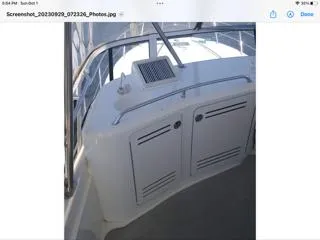 Slide: The Image of 2004 Sea Ray 480 Sedan Bridge yacht interior with sleek white cabinetry and railing. - 9