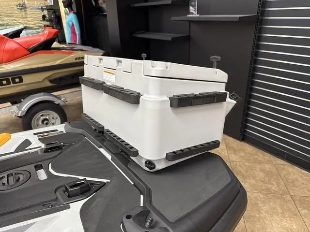Slide: The Image of 2025 Sea-Doo Waverunner FISH PRO with storage box in showroom. - 11