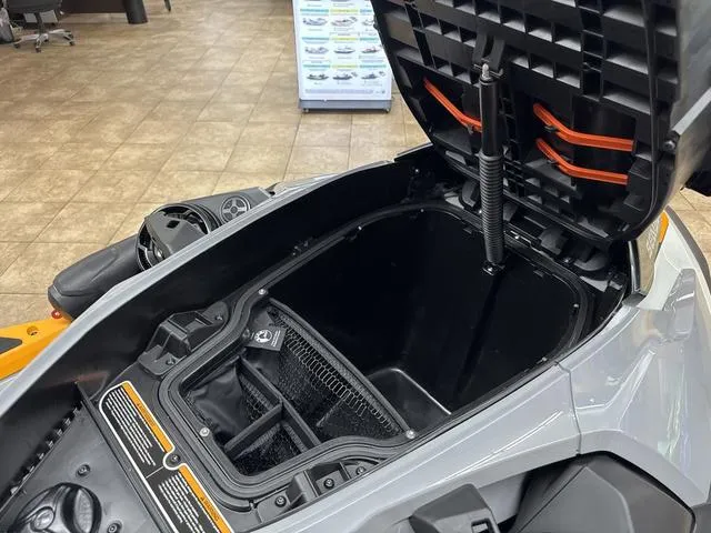 Slide: The Image of 2025 Sea-Doo Waverunner FISH PRO storage compartment open, showcasing spacious interior design. - 15