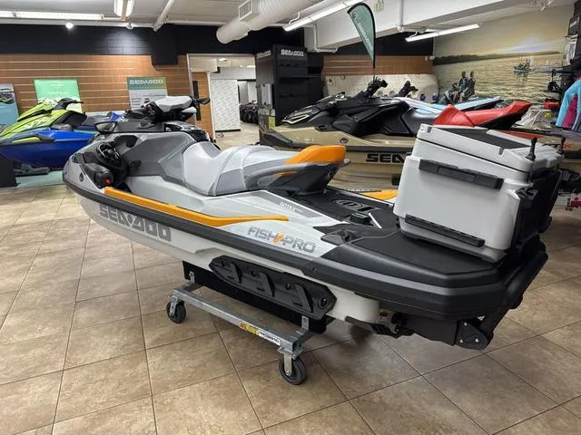 Slide: The Image of 2025 Sea-Doo Waverunner FISH PRO on display in showroom, featuring sleek design and fishing accessories. - 3