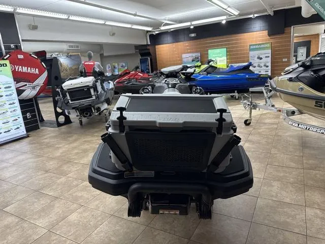 Slide: The Image of 2025 Sea-Doo Waverunner FISH PRO displayed in a showroom with various models. - 4