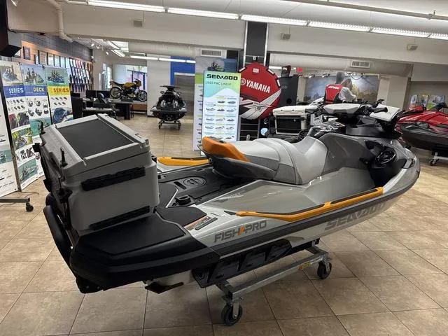 Slide: The Image of 2025 Sea-Doo Waverunner FISH PRO displayed in showroom, featuring sleek design and fishing equipment. - 5
