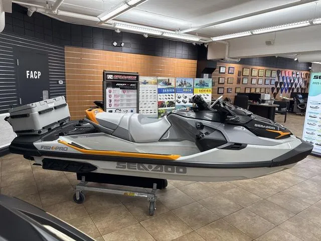 Slide: The Image of 2025 Sea-Doo Waverunner FISH PRO on display in a showroom setting. - 6