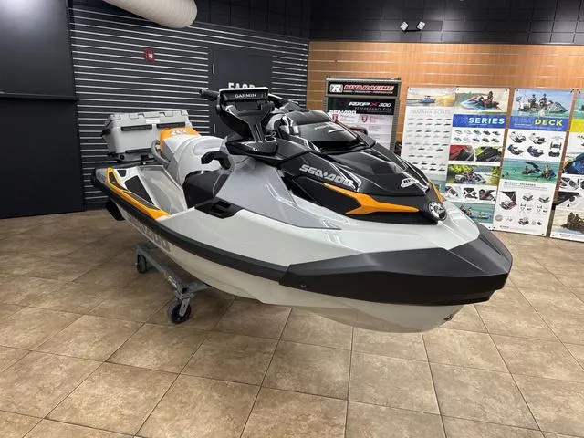Slide: The Image of 2025 Sea-Doo Waverunner FISH PRO displayed in showroom with promotional posters. - 7