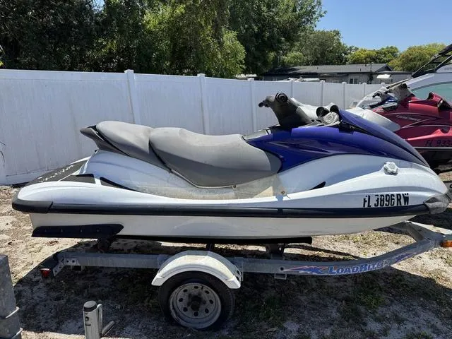 Slide: The Image of 2004 Yamaha WaveRunner FX jet ski on trailer, parked outdoors. - 2