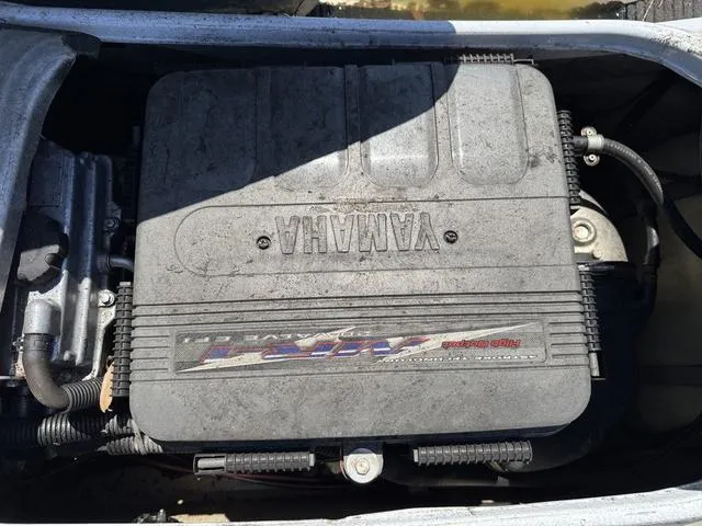 Slide: The Image of 2004 Yamaha WaveRunner FX engine compartment, showcasing the engine cover and components. - 6