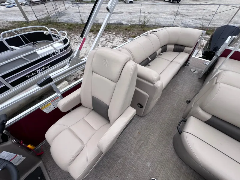 Slide: The Image of 2022 Sun Tracker Party Barge 22 RF XP3 interior with beige seating and spacious layout. - 10