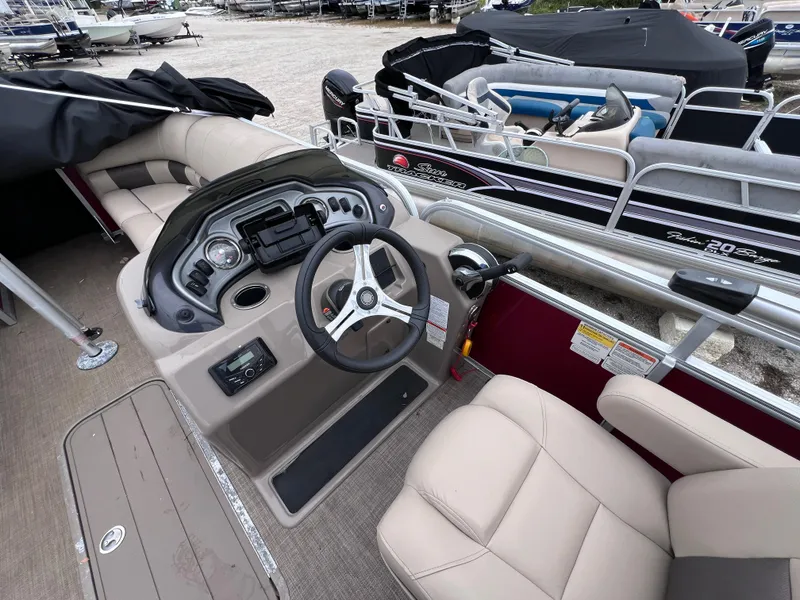 Slide: The Image of Interior of 2022 Sun Tracker Party Barge 22 RF XP3 pontoon boat with steering console. - 11