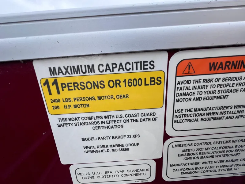 Slide: The Image of 2022 Sun Tracker Party Barge 22 RF XP3 capacity label, max 11 persons or 1600 lbs. - 12