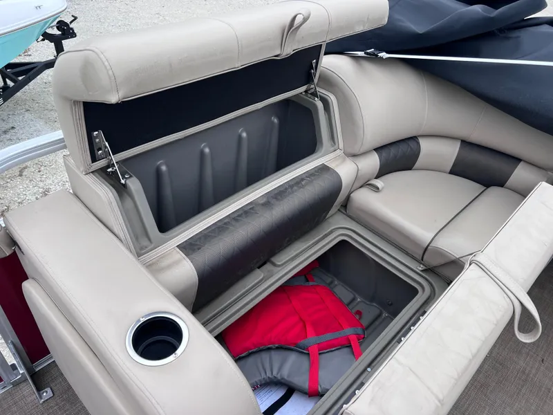 Slide: The Image of 2022 Sun Tracker Party Barge 22 RF XP3 seating with storage compartments and cup holder. - 20