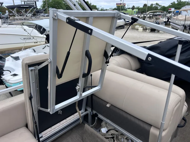 Slide: The Image of 2022 Sun Tracker Party Barge 22 RF XP3 interior with seating and storage compartments. - 21