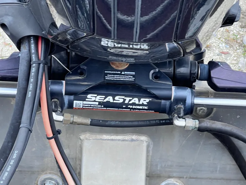 Slide: The Image of Close-up of SeaStar hydraulic steering system on 2022 Sun Tracker Party Barge 22 RF XP3. - 24
