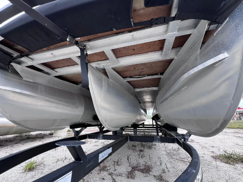 Slide: The Image of Underneath view of 2022 Sun Tracker Party Barge 22 RF XP3 pontoon boat on trailer. - 3