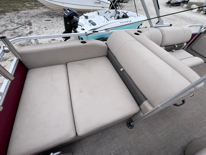 Slide: The Image of 2022 Sun Tracker Party Barge 22 RF XP3 with beige seating and cup holders. - 7