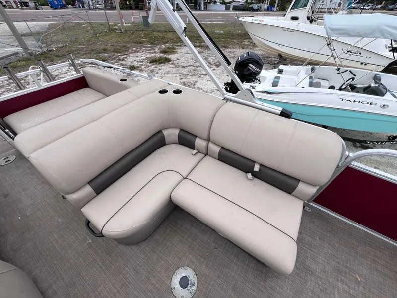 Slide: The Image of 2022 Sun Tracker Party Barge 22 RF XP3 with beige seating and cup holders. - 9
