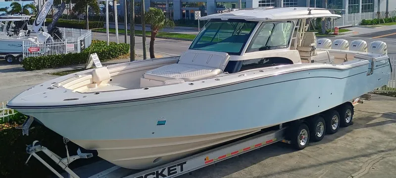 The Image of 2025 Grady-White Canyon 456 boat on trailer, parked outdoors. - 0